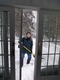 Kathy shovels the deck