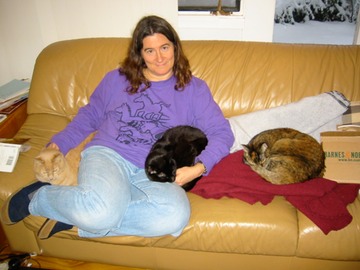 Kathy with three cats