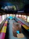 Banana bus interior. Note dance floor and poles
