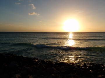 Crossed waves at sunset