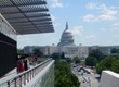 Kathy at the Newseum with Capitol behind