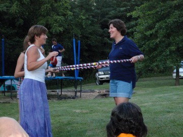 Julie teaches Kathy to hoop
