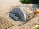 This was on (in?) the beach behind the restaurant.