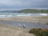 Half-moon Bay, or thereabouts, with plenty of surfers.