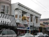 Haight-Ashbury.  Check ou tthe street sign under the legs.  Still a happenin' place.