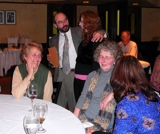 Ben lectures Emilie about something.  Bobbi is amused, Gitte appalled.  Kathy looks on.