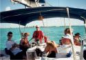 A happy crew with Anegada astern.