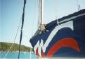 Ross fends off the papparazzi while up in the sail cradle fixing a batten.