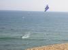 Kitesurfing (!)  Check out www.kitesurfing.com for more info.  Cool and crazy.